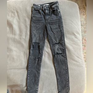 Levi skinny jeans; stretchy; black denim; size 25